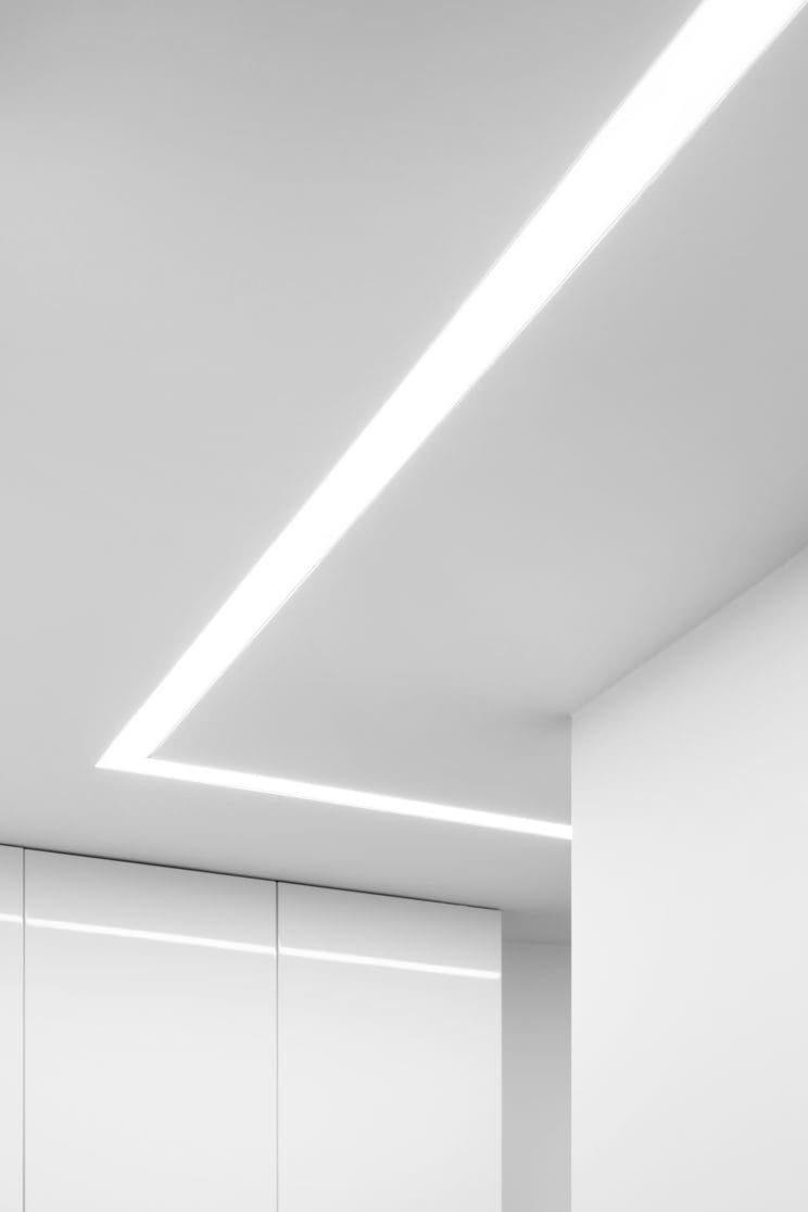 Modern interior in white with decorative led ceiling light